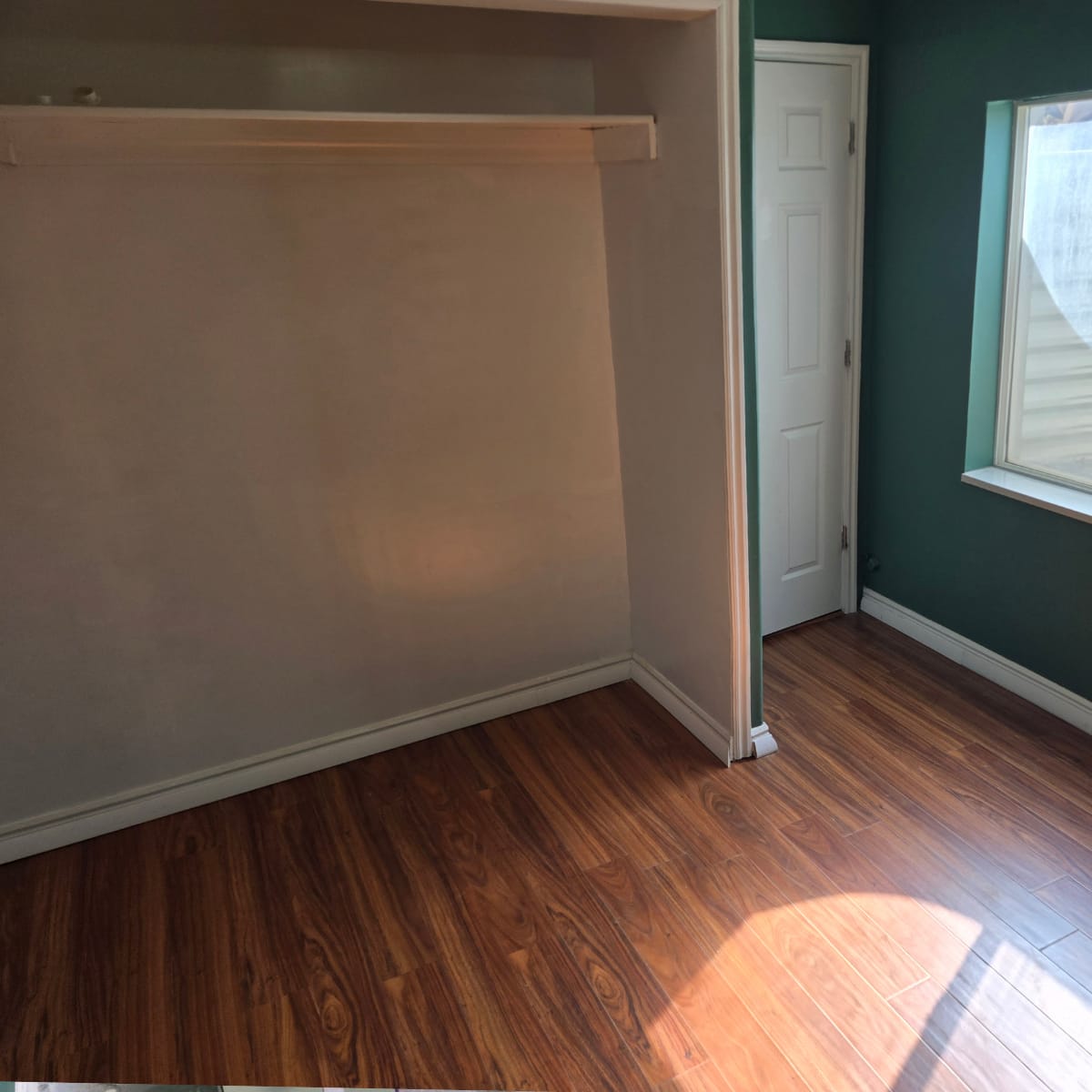 Flooring installation before — exposed subfloor during bedroom renovation in Salt Lake Valley UT