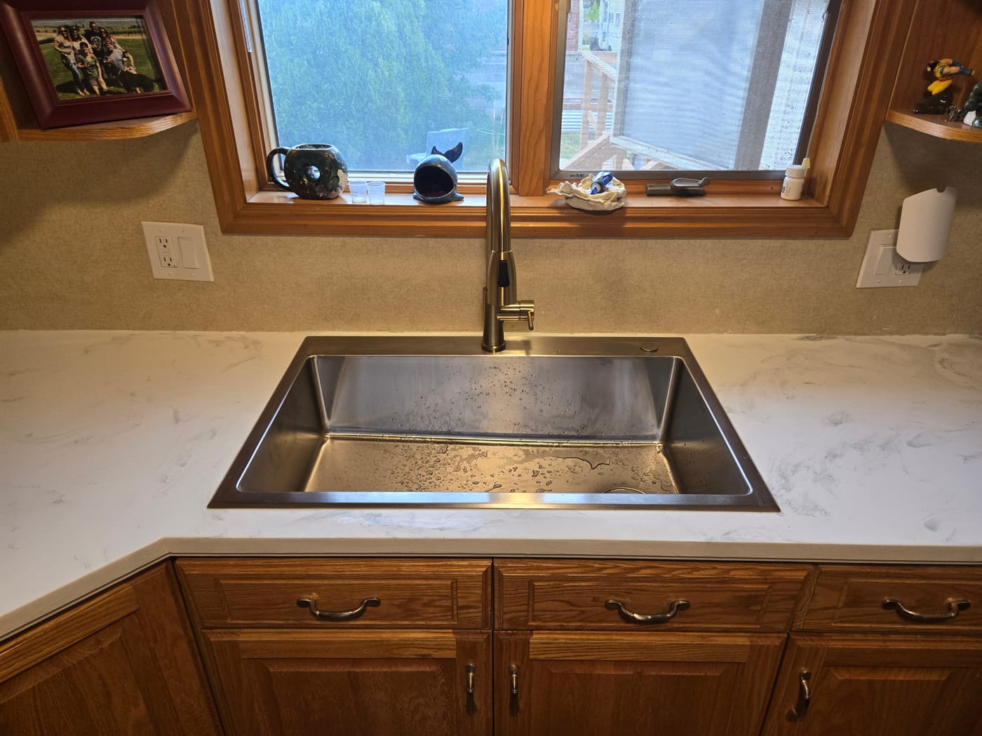 Kitchen sink and countertop before — original setup prior to quartz countertop and sink upgrade in Salt Lake Valley UT